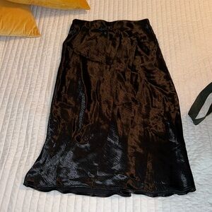 Black satin skirt.